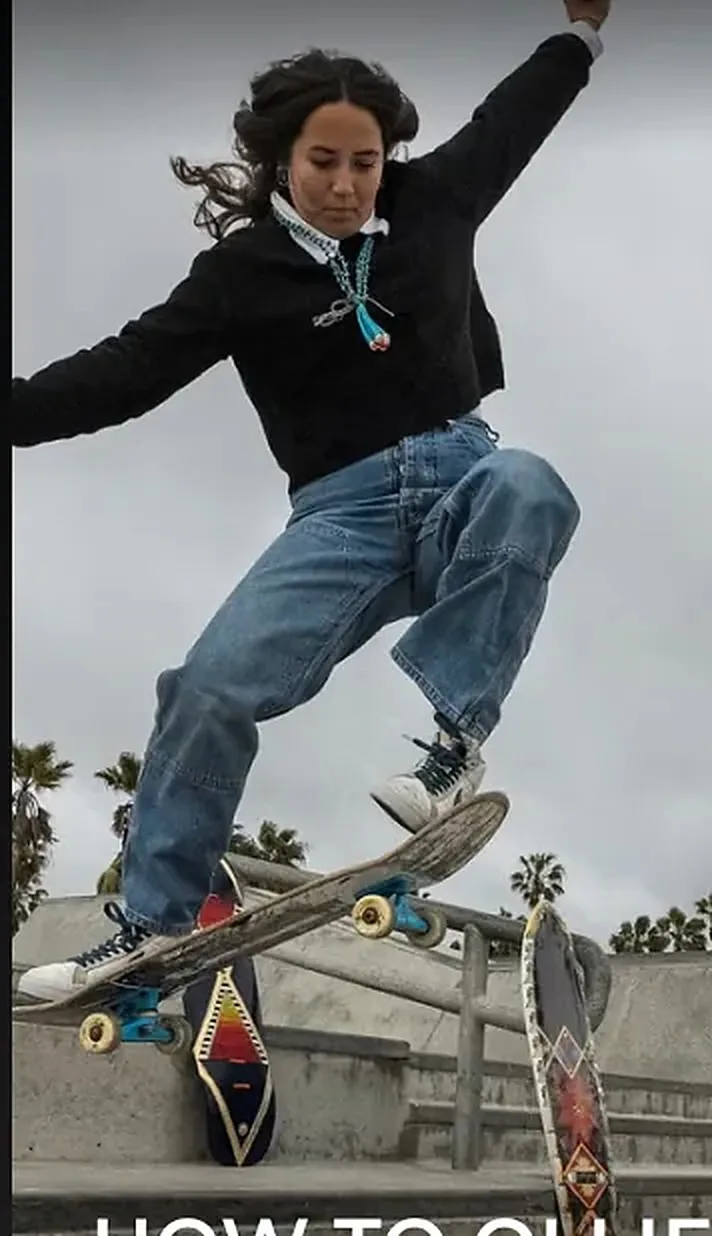 A skateboarder mid-ollie